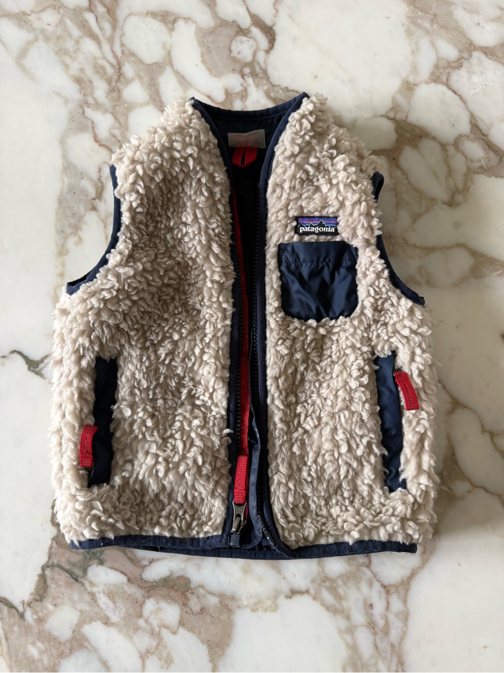 Patagonia Kids Cream Sherpa Vest with Navy Accents and Red Zipper Pulls 2T